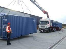 Crane lifting a container conversion